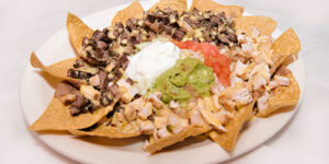 Enjoy the best Tex Mex nachos to start your lunch or dinner at Mariachis in Brenham, TX