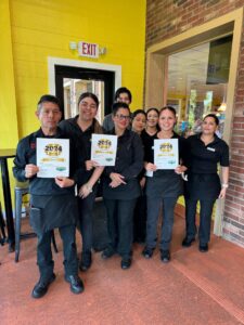 Mariachis staff in Brenham accepting awards.